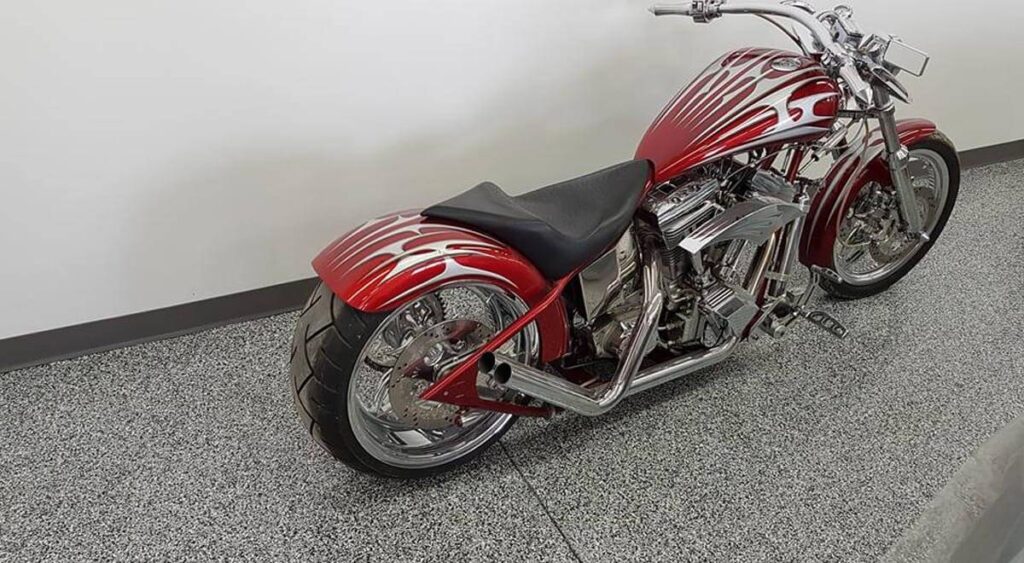 Red motorcycle sitting on new epoxy garage floor
