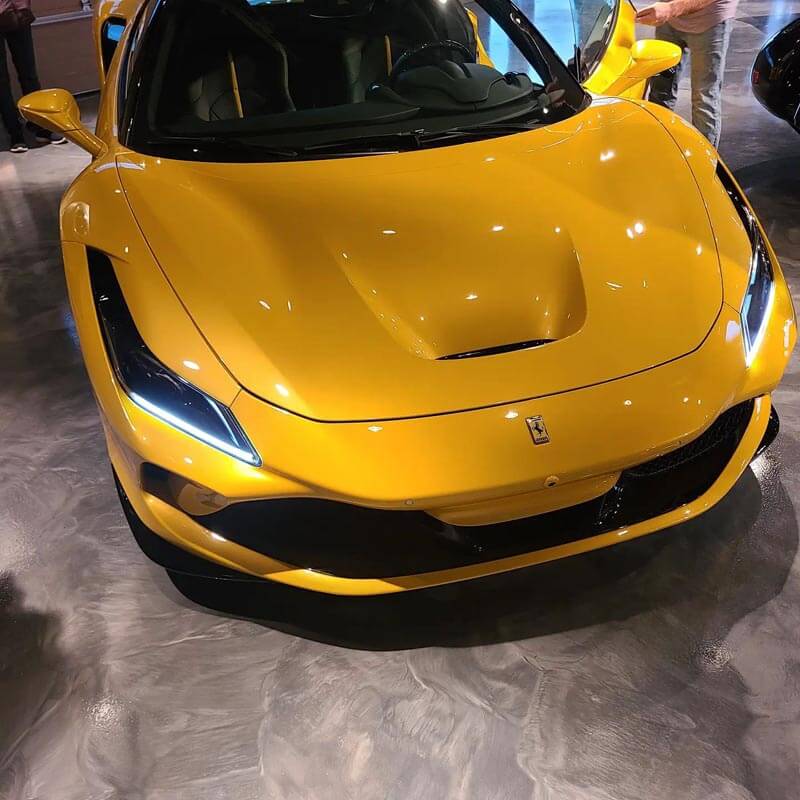 High quality epoxy garage floor under yellow sports car