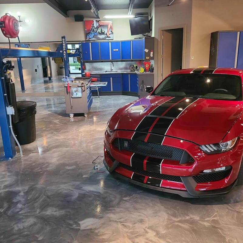 Red sports car on outstanding epoxy garage floor